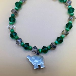 Green and smoke crystal with green cat’s-eye spacers with white crystal elephant
